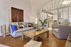 a living room with two couches and a coffee table at La Veore in Chabeuil