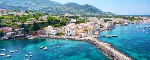 an aerial view of a city with boats in the water at Perla Marina - Salerno in Salerno