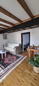 a living room with a bed and a rug at Casa Almarex in Gobiendes