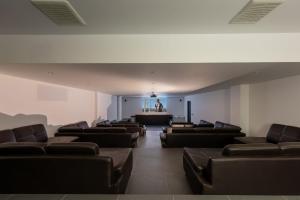 a waiting room with leather chairs and a podium at Villa Veha, SPA, Fitness and Games room in Amphoe Koh Samui +126 photos