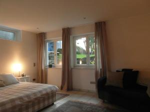 En eller flere senge i et værelse på Bei Bo in Rösrath