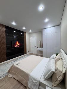 Ένα ή περισσότερα κρεβάτια σε δωμάτιο στο Апартаменты в ЖК 4YOU +5 φωτογραφίες