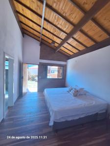 Ένα ή περισσότερα κρεβάτια σε δωμάτιο στο Casa das Quatro Estações - Lapinha da Serra