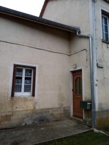 a house with a door and a window at Maïstine - Chambres d hôte in Dancevoir