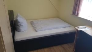 Ένα ή περισσότερα κρεβάτια σε δωμάτιο στο Bastan - Haus Katharina