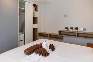 Ένα ή περισσότερα κρεβάτια σε δωμάτιο στο Comfy 1-BR WeKata condo, 5 min to Kata beach +33 φωτογραφίες