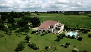 an aerial view of a house with a swimming pool at Gites Gayet in Fours