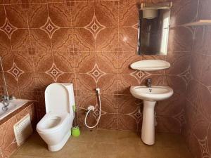 Koupelna v ubytování AS Appartement meublé + 103 fotografií