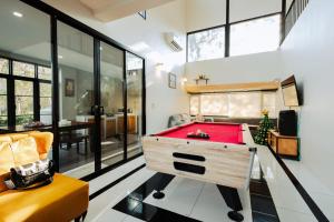 a room with a red pool table in it at Cosy Pool Villa at Khaoyai in Nong Nam Daeng