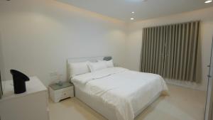 Ένα ή περισσότερα κρεβάτια σε δωμάτιο στο MK Luxury Apartment