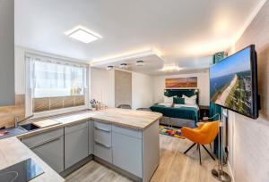 TV a/nebo společenská místnost v ubytování Ferienwohnungen zum Ostseestrand