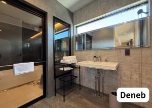 a bathroom with a sink and a mirror at Room 2type Fuji Trip House Sepia 3F and Deneb 4F in Azagawa +47 photos