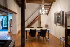 a dining room with a table and chairs at Maison 2 in Souvigny