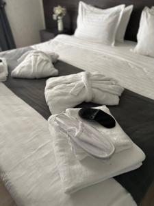 two beds with white towels on top of them at Hotel Sevinch in Tashkent +36 photos