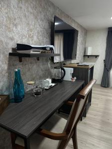 a dining room table and chairs in a room at Hotel Sevinch in Tashkent