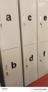 a row of lockers with letters and numbers on them at NongKhiaw Mimosa Dormitory in Nongkhiaw