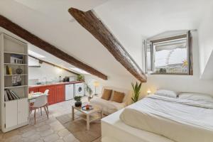 a bedroom with a bed and a living room at Studio Place Masséna Vieux Nice - situation idéale in Nice