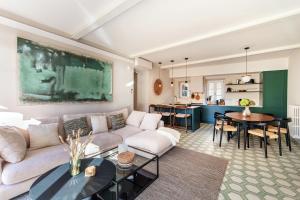 a living room with a couch and a table at Once in a Lifetime - by MyHomeInComo in Laglio