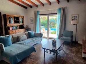 a living room with a couch and a table at Alsouk in Vilamoura