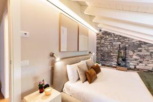 a bedroom with a bed and a fireplace at Once in a Lifetime - by MyHomeInComo in Laglio