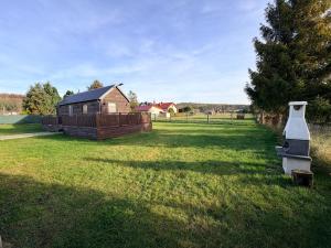 Κήπος έξω από το Domek Perła Tyłowo +9 φωτογραφίες