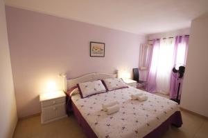 Postel nebo postele na pokoji v ubytování Casa Lara