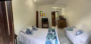 Ένα ή περισσότερα κρεβάτια σε δωμάτιο στο Lua Chalés