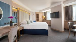 Ένα ή περισσότερα κρεβάτια σε δωμάτιο στο Danubius Hotel Regents Park +49 φωτογραφίες