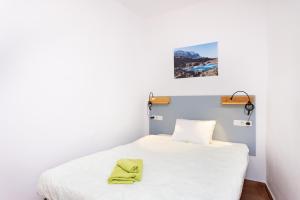 Ένα ή περισσότερα κρεβάτια σε δωμάτιο στο Tabaiba Guesthouse