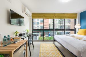 Ένα ή περισσότερα κρεβάτια σε δωμάτιο στο Lachata - Hua Mak