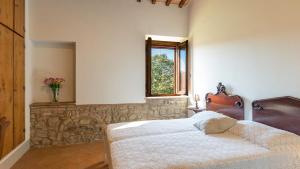 Postel nebo postele na pokoji v ubytování PODERE FABBRICA 12, Emma Villas