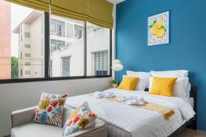 Ένα ή περισσότερα κρεβάτια σε δωμάτιο στο Lachata - Hua Mak +36 φωτογραφίες