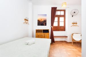 Postel nebo postele na pokoji v ubytování Tabaiba Guesthouse