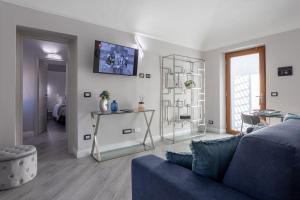 Μια τηλεόραση ή/και κέντρο ψυχαγωγίας στο Appartamento in città immerso nel verde