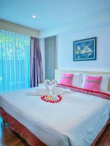 Postel nebo postele na pokoji v ubytování MS Hotel Sriracha + 32 fotografií