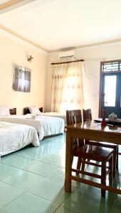 Ένα ή περισσότερα κρεβάτια σε δωμάτιο στο Khách sạn phong châu sốp cộp