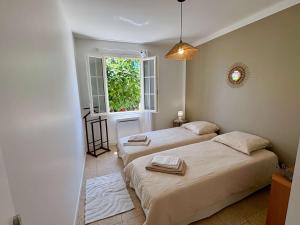 Postel nebo postele na pokoji v ubytování La Douce Parenthèse