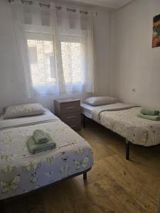 Ένα ή περισσότερα κρεβάτια σε δωμάτιο στο Calas De Cabo Roig