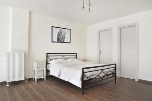 Ένα ή περισσότερα κρεβάτια σε δωμάτιο στο Annabell Houses & Rooms