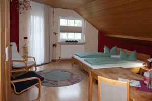 Ένα ή περισσότερα κρεβάτια σε δωμάτιο στο Chefs Gästezimmer