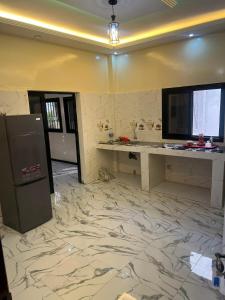 Kuchyň nebo kuchyňský kout v ubytování Appartement meublé, confortable et abordable à Saint-Louis