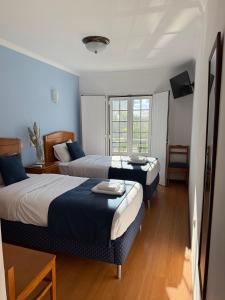 Postel nebo postele na pokoji v ubytování Hospedaria Canto do Rossio