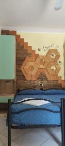 a bedroom with two beds with a bear mural on the wall at Country House UNA in Cupra Marittima