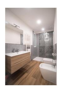 a bathroom with a sink and a tub and a toilet at Matt house in La Spezia +19 photos