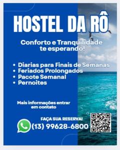 a sign that reads hospital da ro with the ocean at Casa Hostel da Rô in Praia Grande