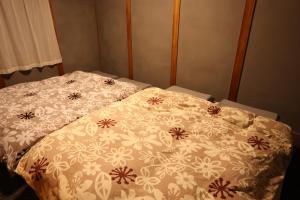 Postel nebo postele na pokoji v ubytování BBQが出来る一棟貸切のお宿newisland