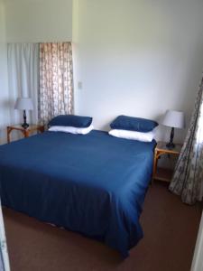 Postel nebo postele na pokoji v ubytování Sandoway