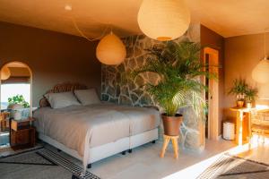 Ένα ή περισσότερα κρεβάτια σε δωμάτιο στο Hija de las Flores