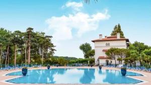 a large swimming pool in front of a building at Bed & Views - Le paradis de Bordaberry in Urrugne