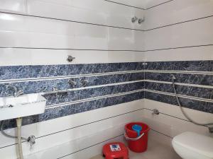 a bathroom with a toilet and a sink at Shubham guest house in Gwalior